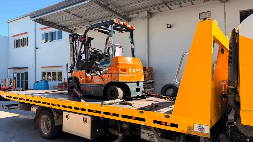 Toyota forklift secured on a tilt tray for forklift transport in Brisbane