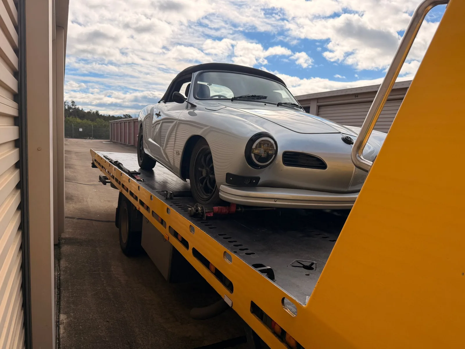 TowFast Brisbane towing a classic car on a tilt tray truck