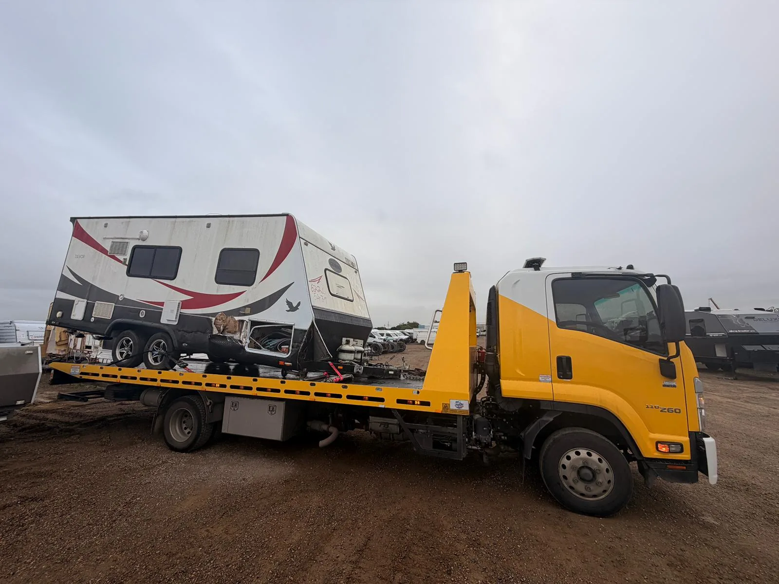 TowFast Brisbane tilt tray truck transporting a caravan