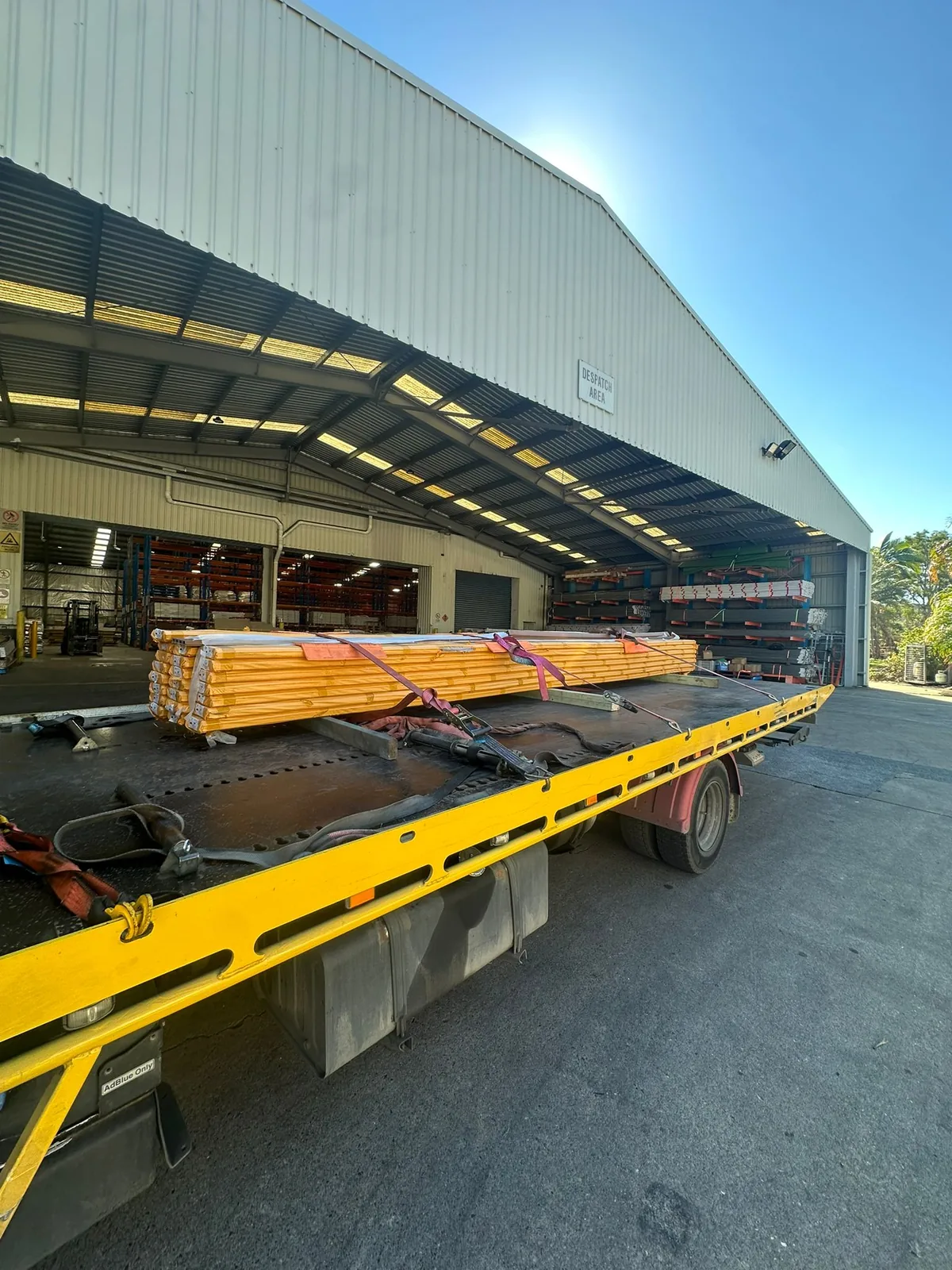 TowFast Brisbane tilt tray truck transporting trade equipment in Brisbane