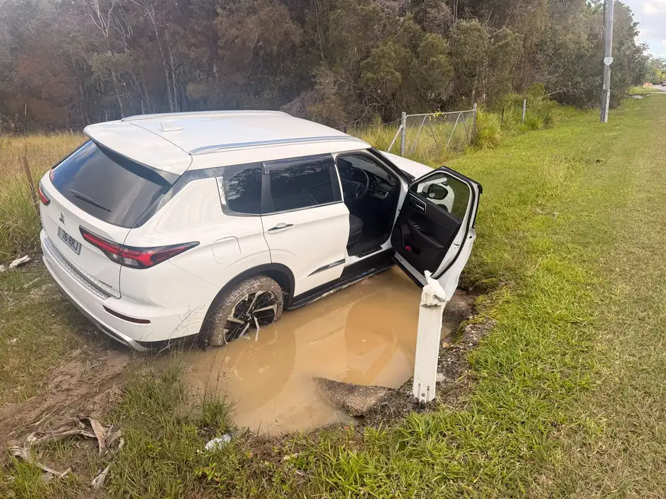 White SUV bogged in mud during a TowFast Brisbane recovery job