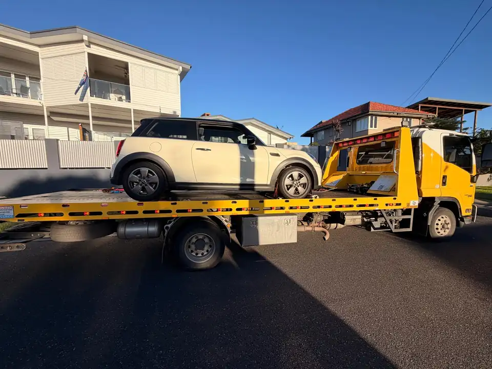 TowFast Brisbane tilt tray transporting a white car