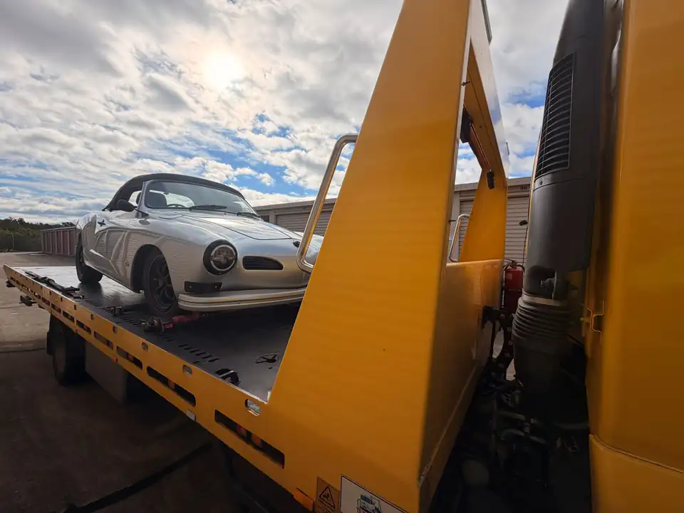 Classic silver car loaded on a TowFast Brisbane tilt tray
