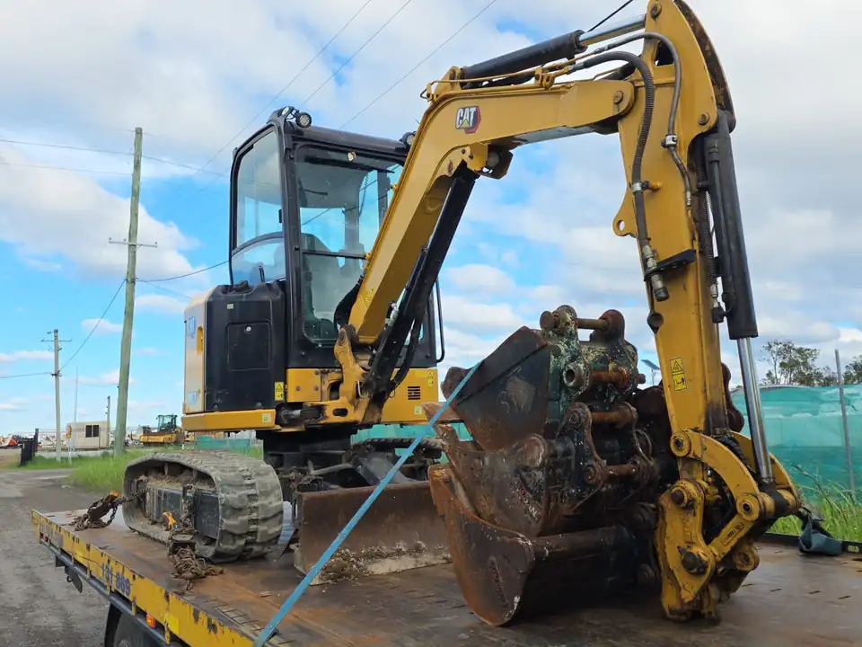 Compact excavator secured on a TowFast Brisbane tilt tray