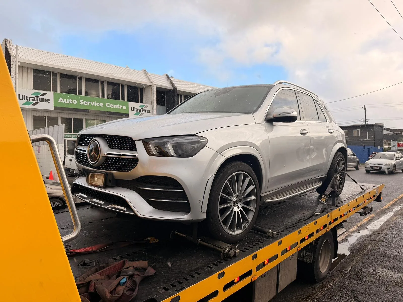 TowFast Brisbane tilt tray tow truck carrying a Mercedes SUV for breakdown towing in Brisbane